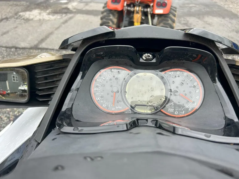 Slide: The Image of Dashboard of a 2012 Sea-Doo GTX 155 with raindrops on the gauges. - 24