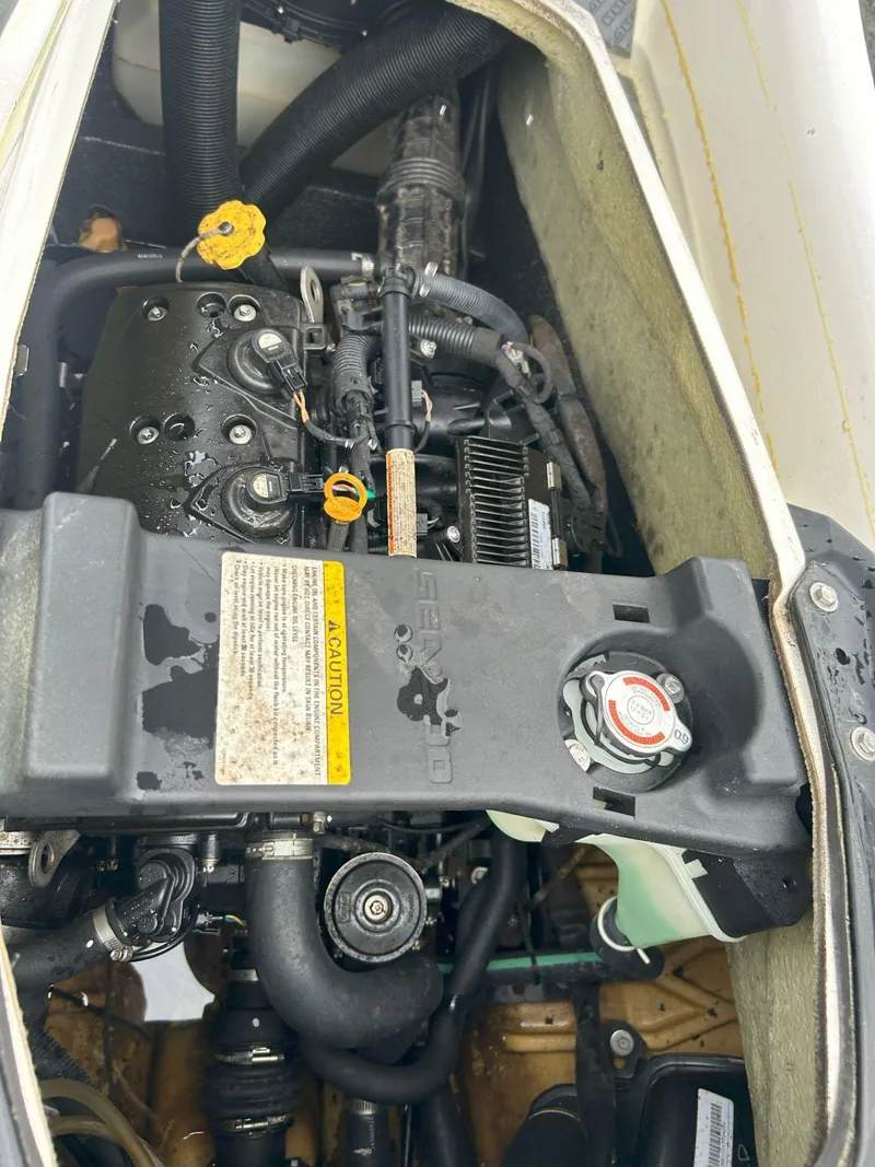 Slide: The Image of 2012 Sea-Doo GTX 155 engine compartment, showcasing internal components and design. - 25