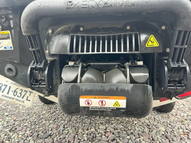 Slide: The Image of Rear view of a 2012 Sea-Doo GTX 155 jet ski engine with warning labels. - 26