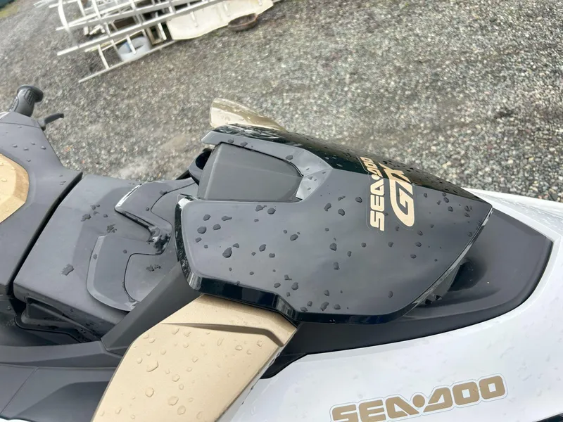 Slide: The Image of 2012 Sea-Doo GTX 155 jet ski with raindrops on seat and handlebars. - 27