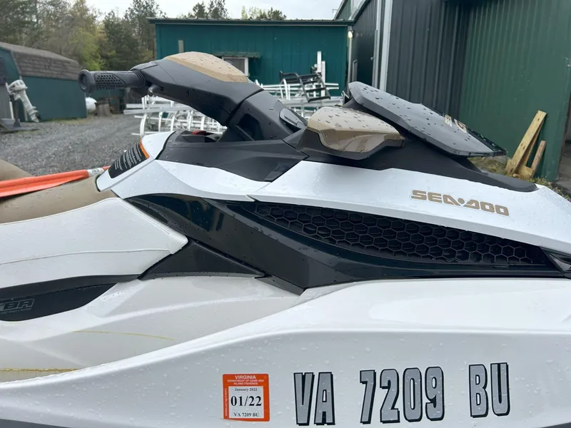 Slide: The Image of 2012 Sea-Doo GTX 155 jet ski with Virginia registration, parked outdoors. - 3