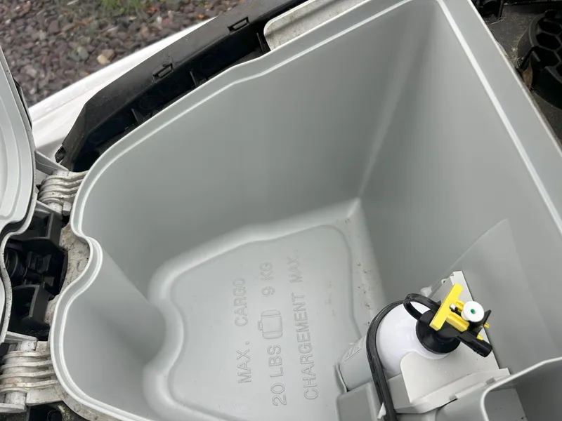 Slide: The Image of Open storage compartment of 2012 Sea-Doo GTX 155 with cargo capacity details. - 30