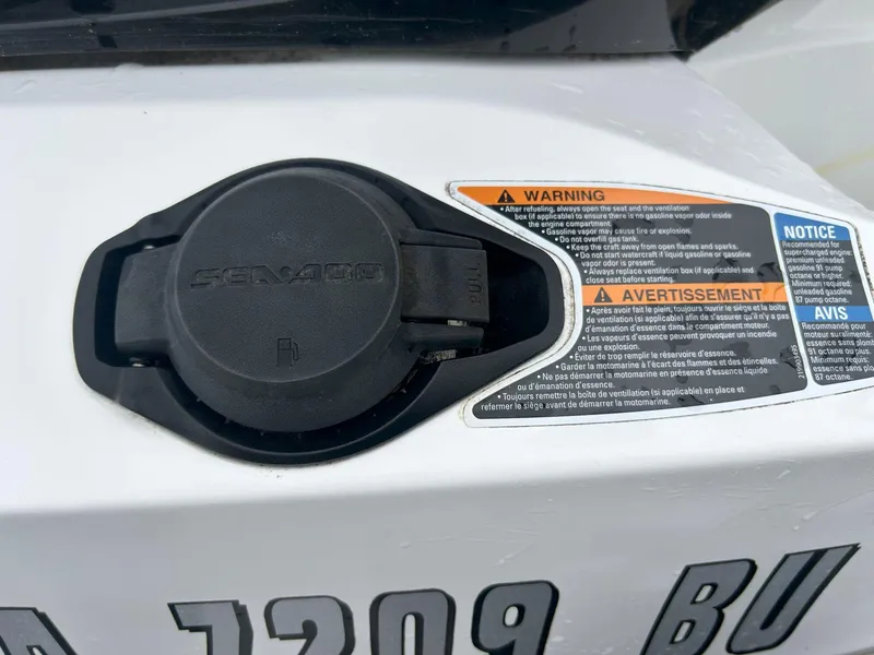 Slide: The Image of 2012 Sea-Doo GTX 155 fuel cap with warning labels and registration number. - 31