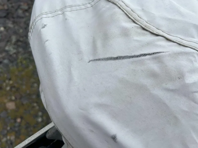 Slide: The Image of White fabric with visible tear on a 2012 Sea-Doo GTX 155. - 34
