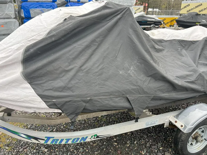 Slide: The Image of Covered 2012 Sea-Doo GTX 155 on Triton trailer, parked on gravel. - 38