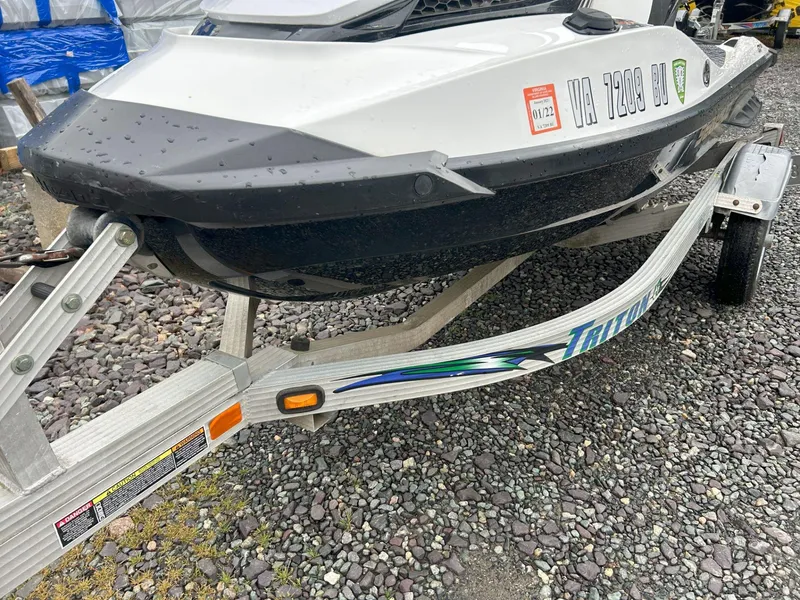 Slide: The Image of 2012 Sea-Doo GTX 155 on Triton trailer, parked on gravel. - 4