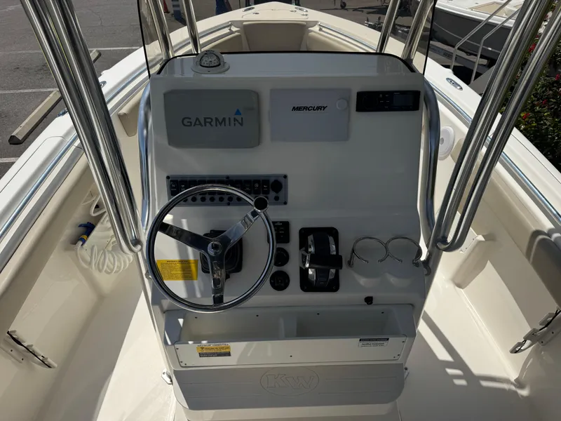 Slide: The Image of 2022 Key West 239 FS boat console with Garmin and Mercury controls. - 16