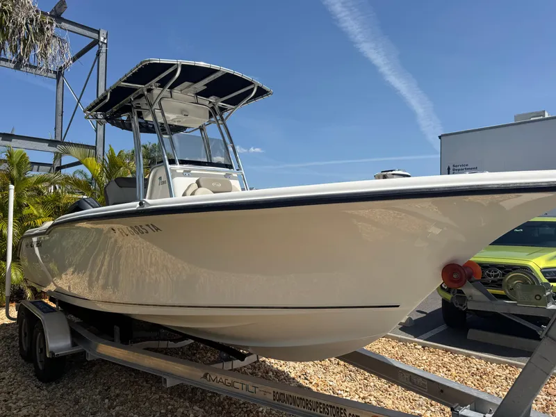 Slide: The Image of 2022 Key West 239 FS boat on trailer, sunny day, blue sky background. - 4
