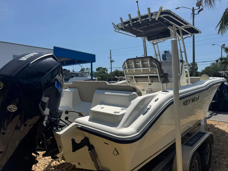 Slide: The Image of 2022 Key West 239 FS boat with Yamaha engine, parked on a trailer. - 7