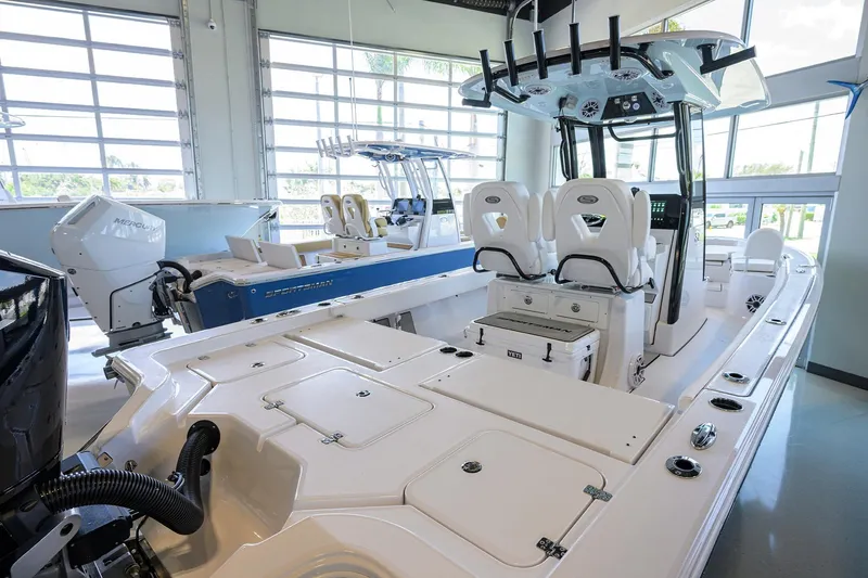 Slide: The Image of 2025 Sportsman Masters 267 Bay Boat in showroom, showcasing sleek design and modern features. - 20