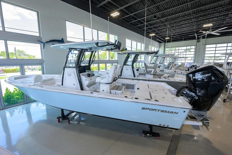 Slide: The Image of 2025 Sportsman Masters 267 Bay Boat displayed in a showroom. - 3