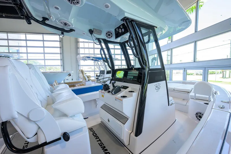Slide: The Image of 2025 Sportsman Masters 267 Bay Boat interior with modern console and seating. - 30
