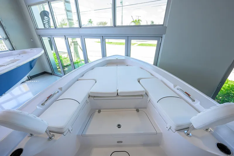 Slide: The Image of 2025 Sportsman Masters 267 Bay Boat interior with cushioned seating and sleek design. - 6