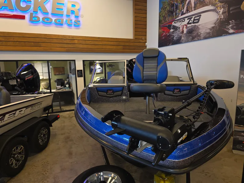 Slide: The Image of 2025 Ranger 1880MS boat displayed in showroom with blue accents and modern design. - 4
