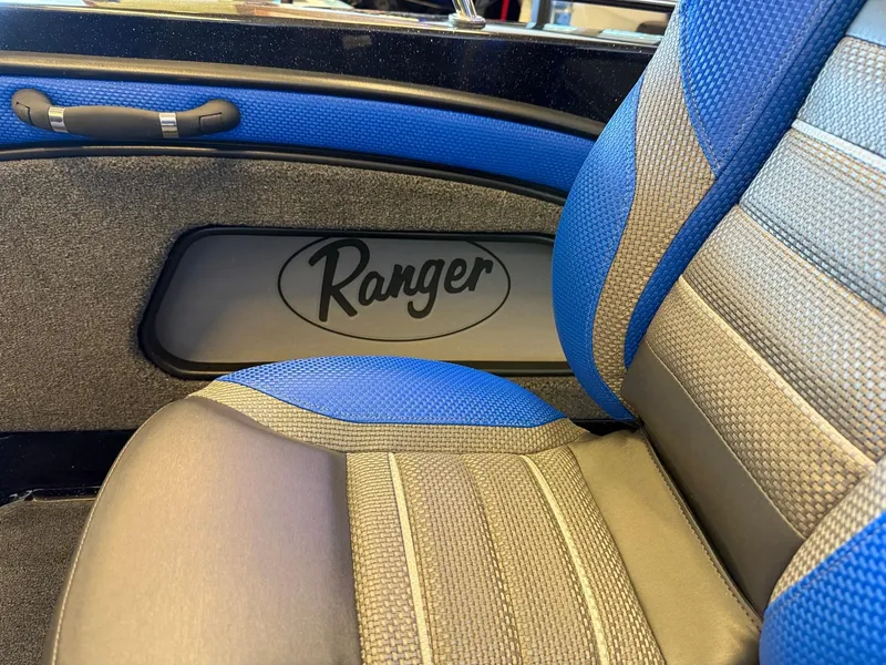 Slide: The Image of 2025 Ranger 1880MS interior with blue and gray seating, featuring Ranger logo. - 5