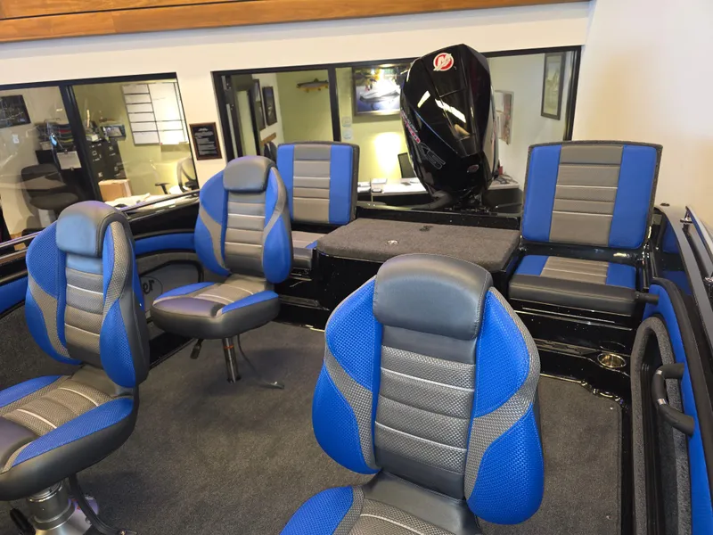 Slide: The Image of 2025 Ranger 1880MS boat interior with blue and gray seating, showcasing modern design. - 6