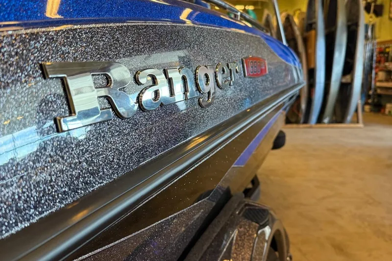 Slide: The Image of 2025 Ranger 1880MS boat with metallic finish in a showroom. - 8