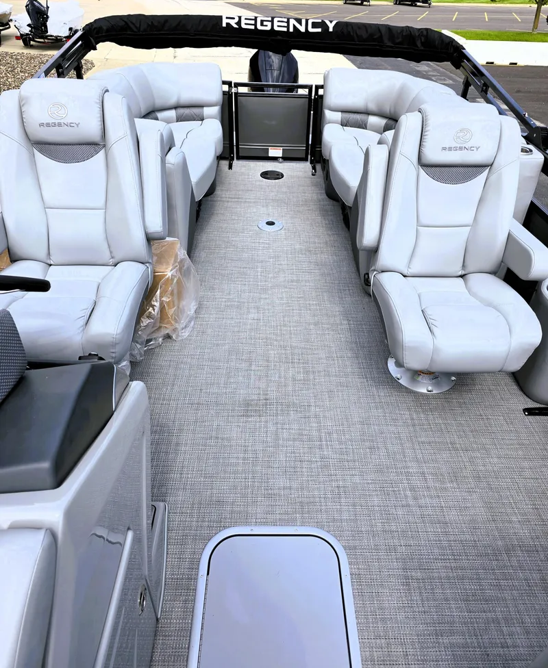 Slide: The Image of 2025 Regency 230 LE3 pontoon boat interior with luxurious seating and modern design. - 4