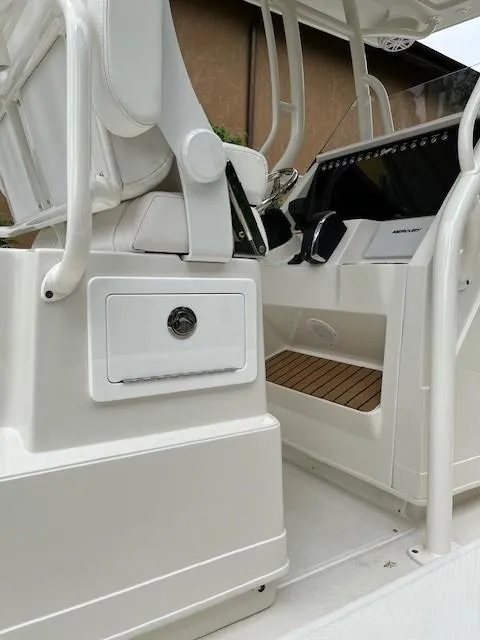 Slide: The Image of 2025 Ranger 2360 Bay boat interior with modern console and seating. - 2