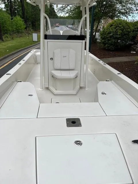 Slide: The Image of 2025 Ranger 2360 Bay boat, spacious deck, white finish, outdoor setting. - 3