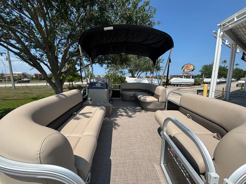 Slide: The Image of 2025 Sun Tracker Party Barge 16 DLX pontoon boat with spacious seating and canopy. - 4