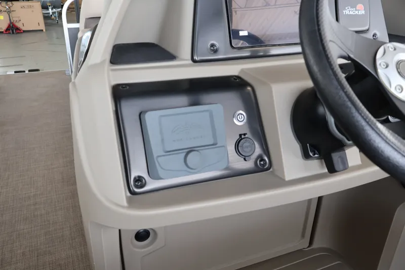 Slide: The Image of Dashboard of 2025 Sun Tracker Party Barge 18 DLX with steering wheel and controls. - 22