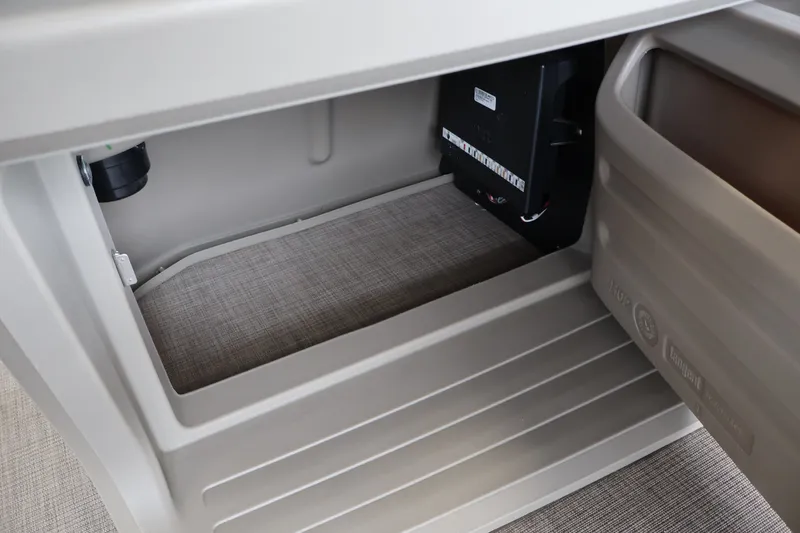 Slide: The Image of Interior storage compartment of 2025 Sun Tracker Party Barge 18 DLX pontoon boat. - 25
