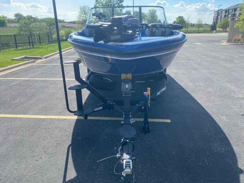 Slide: The Image of 2025 Nitro ZV19 Sport Pro boat on trailer in parking lot. - 2