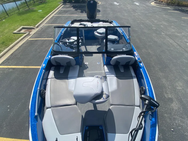 Slide: The Image of 2025 Nitro ZV19 Sport Pro boat with blue exterior and spacious seating. - 4