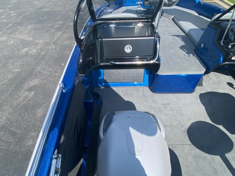 Slide: The Image of 2025 Nitro ZV19 Sport Pro boat interior with blue accents and seating. - 7