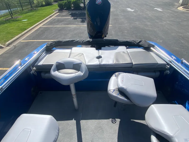 Slide: The Image of 2025 Nitro ZV19 Sport Pro boat interior with gray seating and blue accents. - 8