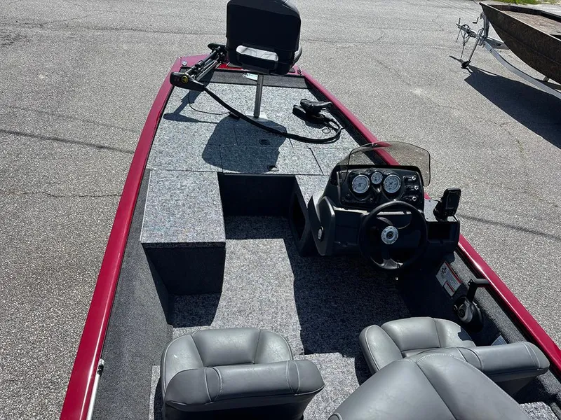Slide: The Image of 2025 Tracker Pro 170 boat interior with steering console and seating. - 10
