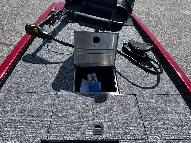 Slide: The Image of 2025 Tracker Pro 170 boat interior with storage compartment and seat. - 14