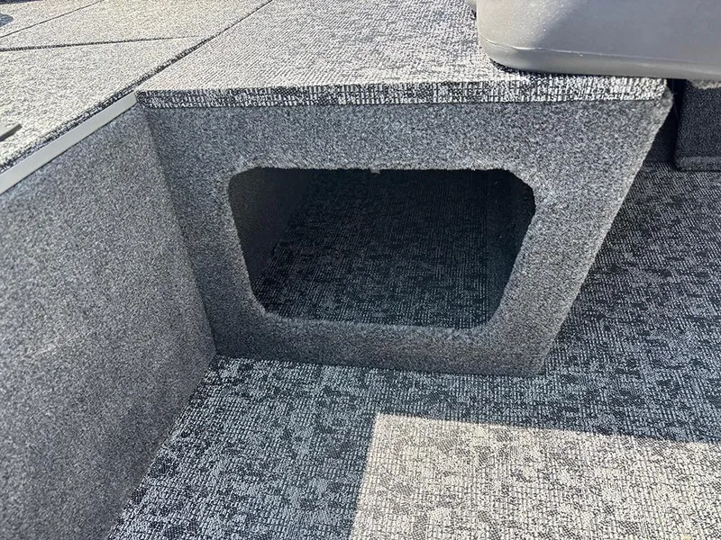 Slide: The Image of 2025 Tracker Pro 170 boat interior with carpeted storage compartment. - 16