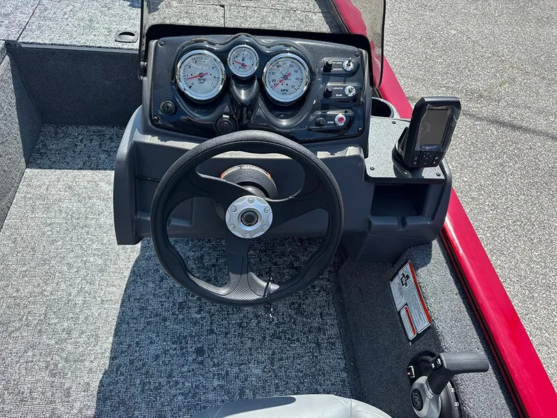 Slide: The Image of 2025 Tracker Pro 170 boat dashboard with steering wheel and gauges. - 17