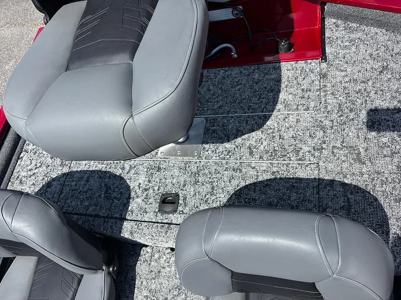 Slide: The Image of 2025 Tracker Pro 170 boat interior with gray seats and textured flooring. - 21