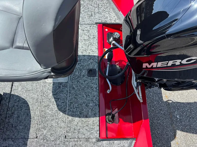 Slide: The Image of 2025 Tracker Pro 170 boat interior with seat and Mercury engine detail. - 22