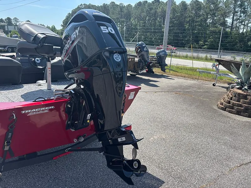 Slide: The Image of 2025 Tracker Pro 170 boat with Mercury 50 engine, parked outdoors. - 24