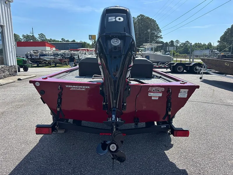 Slide: The Image of 2025 Tracker Pro 170 boat with 50 HP engine, parked outdoors. - 7