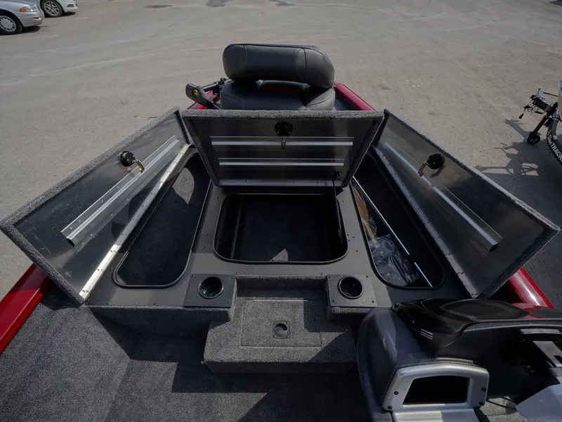Slide: The Image of 2025 Tracker Pro Team 175 boat with open storage compartments and seating. - 10