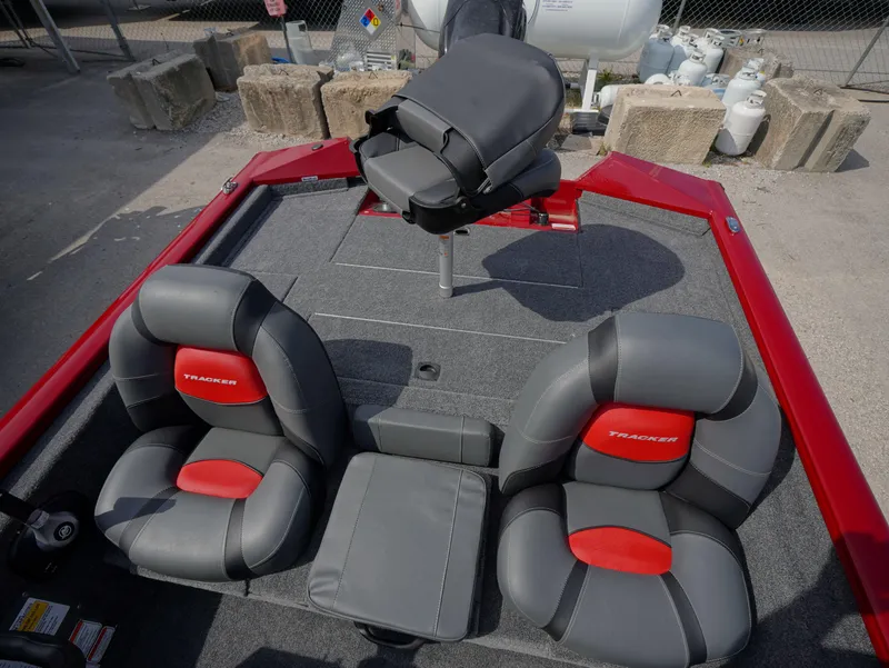 Slide: The Image of 2025 Tracker Pro Team 175 boat interior with gray and red seating. - 11