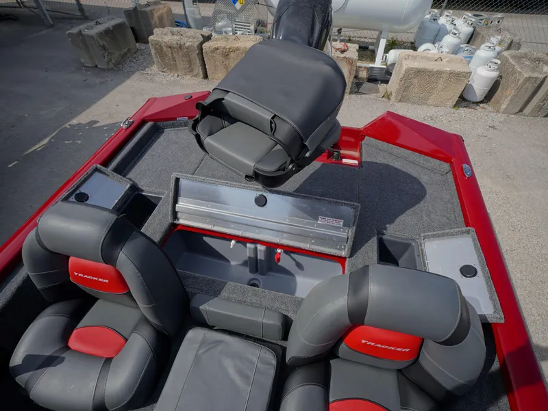 Slide: The Image of 2025 Tracker Pro Team 175 boat interior with gray and red seating. - 12