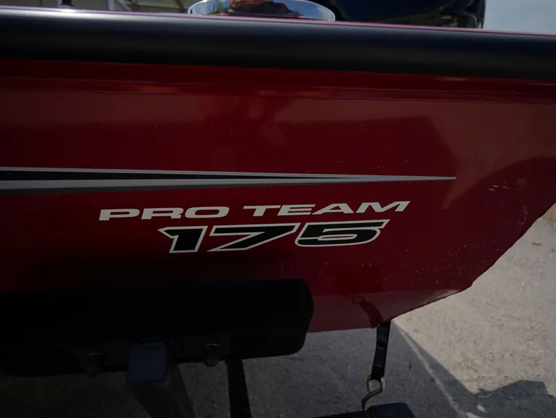 Slide: The Image of Red Tracker Pro Team 175 boat, model year 2025, with bold lettering. - 13