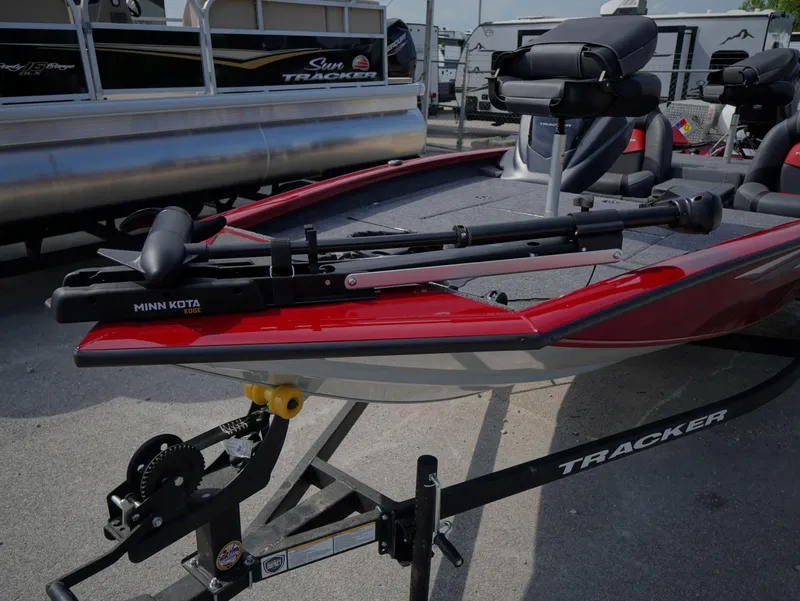 Slide: The Image of 2025 Tracker Pro Team 175 boat with Minn Kota trolling motor on trailer. - 8
