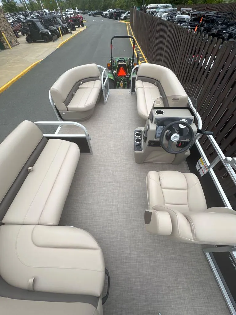 Slide: The Image of 2025 Sun Tracker Party Barge 16 DLX with spacious seating and modern helm. - 2