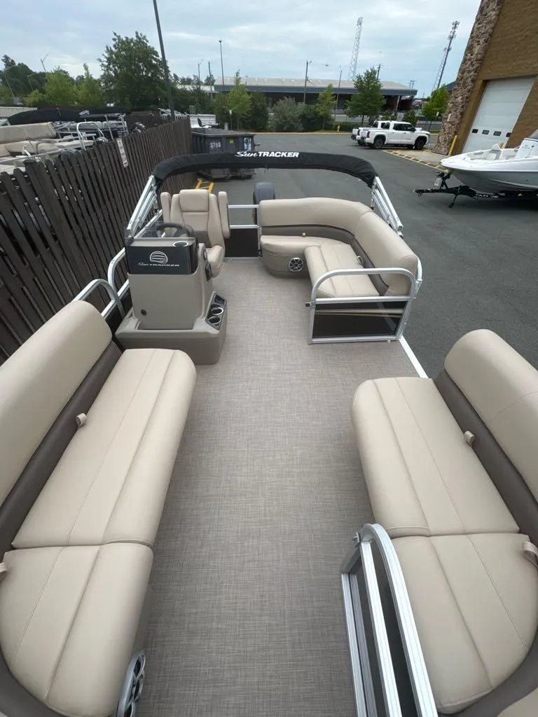 Slide: The Image of 2025 Sun Tracker Party Barge 16 DLX pontoon boat with spacious seating and modern design. - 3