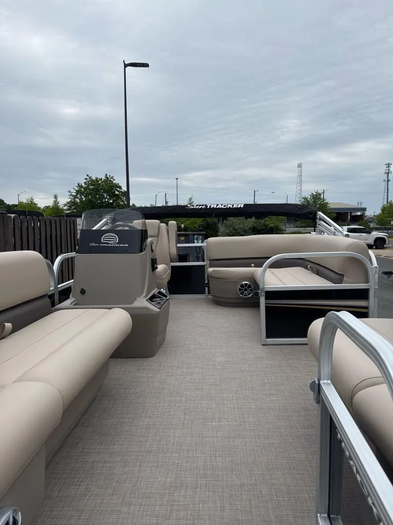 Slide: The Image of 2025 Sun Tracker Party Barge 16 DLX pontoon boat with spacious seating and modern design. - 4