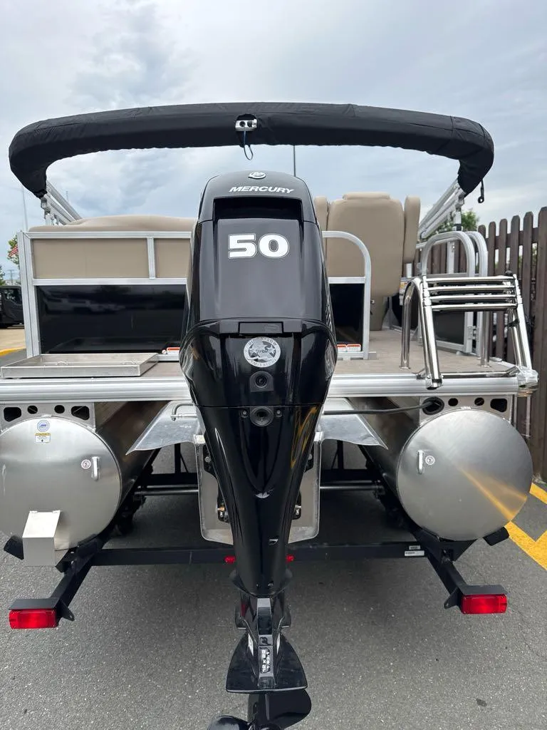 Slide: The Image of 2025 Sun Tracker Party Barge 16 DLX with Mercury 50 HP engine, rear view. - 6