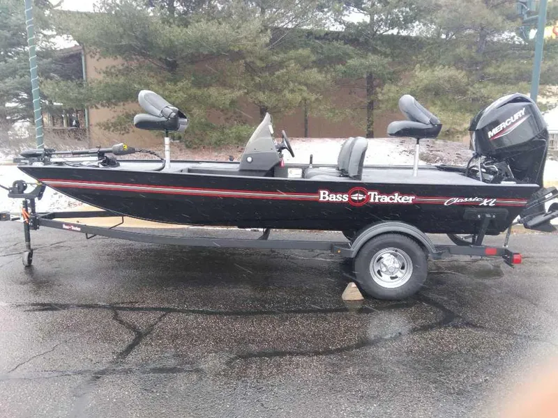 Slide: The Image of 2025 Tracker Bass Tracker Classic XL boat on trailer, parked outdoors. - 44