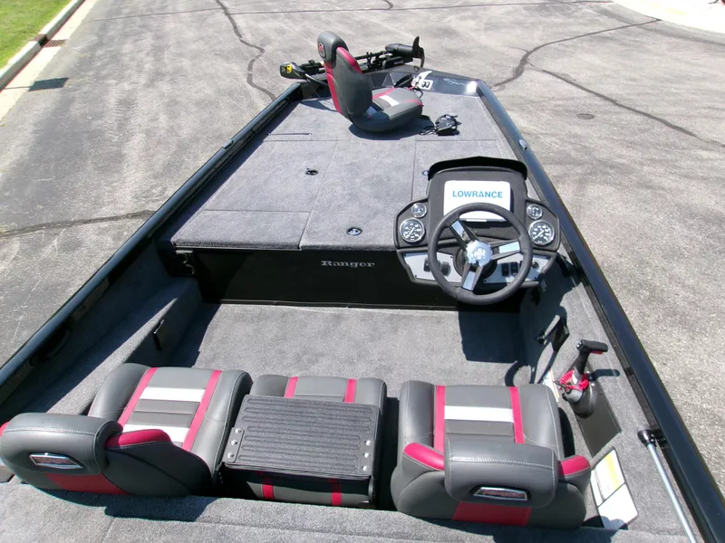 Slide: The Image of 2025 Ranger RT188 boat interior with steering wheel and seating, featuring Lowrance electronics. - 4